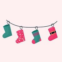 un conjunto de calcetines navideños para regalos en una cuerda. ilustración vectorial vector