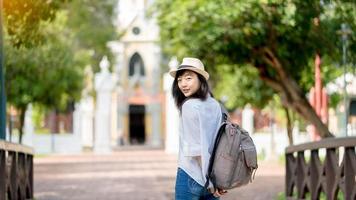 Happy holiday.Lifestyle Image of carefree traveling smiling woman in white shirt and  hat relaxing her vacation time photo