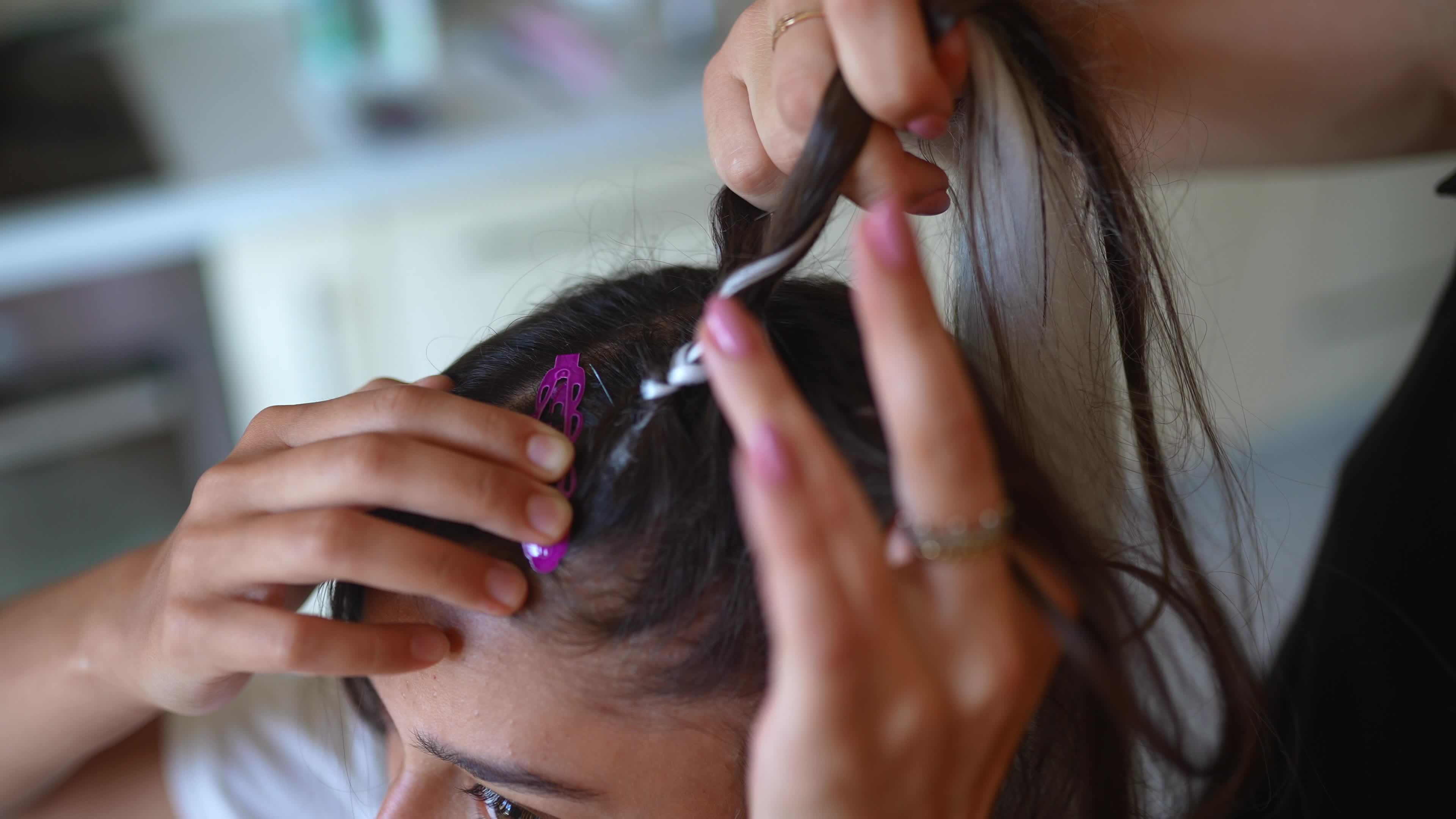 Girls braiding hair with a white strand of hair 13289062 Stock Video at