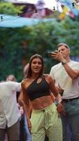 Woman dancing and having fun at outdoor party video