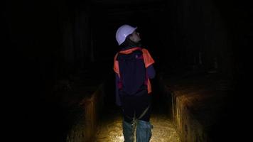 Explorers going in the underground water caves video