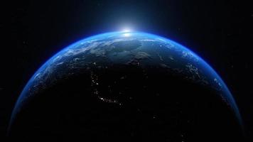 Dawn, the sun rises behind the planet earth. Sunrise over the globe. Top view from the space. Day to night transition, great for the news or climatic change concept. Spacescape background in 4k