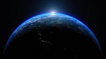 Dawn, the sun rises behind the planet earth. Sunrise over the globe. Top view from the space. Day to night transition, great for the news or climatic change concept. Spacescape background in 4k video