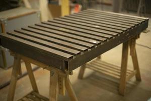 Steel table. Industrial processing. Details of work with structure. photo