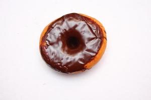 Chocolate Donuts laid on a white background photo