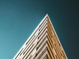 Low angle view of a pointed building at night photo