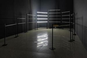 Close up of a mans hand installing a long LED light bulb on the room photo