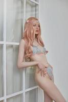 Beautiful elf woman in underwear, long pink hair. Beauty portrait, romantic look retro style photo