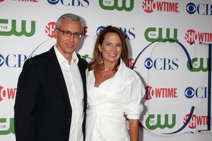 LOS ANGELES, AUG 3 - Drew Pinsky and wife arriving at the CBS TCA Summer 2011 All Star Party at Robinson May Parking Garage on August 3, 2011 in Beverly Hills, CA photo