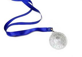 Silver plain metal medal isolated on white background photo