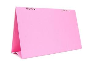 Calendario de escritorio en blanco rosa con aislado sobre fondo blanco. foto