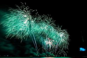 fireworks celebration over sea on pattaya beach photo