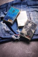 WASHINGTON USA - September 30 2022  Nirvana's cassette tape and Ripped jeans or Torn jeans. A symbol of the grunge or Seattle sound. photo