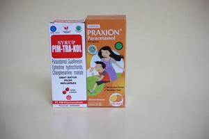 Magelang,Indonesia,2022-Plain background photo isolated with fever-reducing syrup used when a child has a fever.
