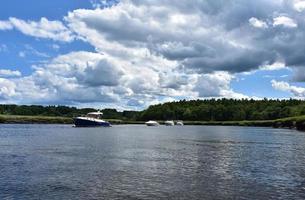 Tidal River with Anchored Boats in It photo