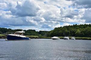 Boats Anchored in a Tidal River on a Spring Day photo