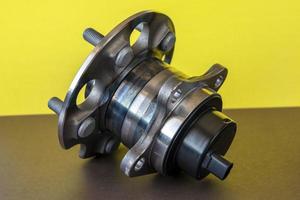 Rear wheel hub assembly with ABS sensor on a colored background, auto parts, bearing photo