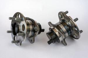 A pair of rear wheel hubs with ABS sensor, isolated on a white background, hub bearing photo