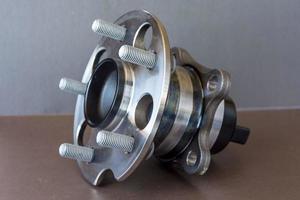 Rear wheel hub assembly with ABS sensor on a colored background, auto parts, bearing photo