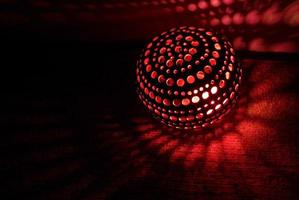 Red light inside a DIY coconut shell lamp photo