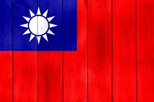 Taiwan flag or Taiwanese banner on wood planks texture. photo