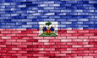 Flag of the Republic of Haiti On the texture of a brick wall. photo