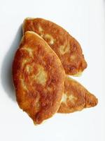 fried pies on a white background. bakery products photo