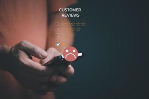 Customer Experience dissatisfied Concept, Unhappy Businessman Client with Sadness Emotion Face on smartphone screen, Bad review, bad service dislike bad quality, low rating, social media not good. photo