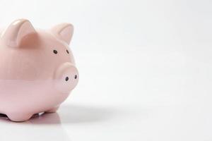 Pink piggy bank isolated on white background. Saving investment budget wealth business retirement, financial, money, banking concept. Copy space. photo