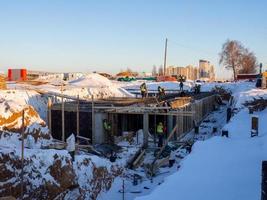 Building construction in winter.   technologies. photo