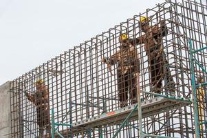 The men working on scaffolding photo