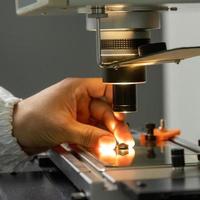 A closeup of the production and quality control of the internal parts of medical syringes photo