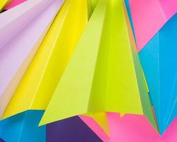 A closeup shot of colorful handmade paper planes photo