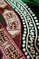 The decorative elements and ornaments on the national clothes of Uzbekistan photo