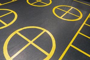 The yellow marks on the floor in the gym photo