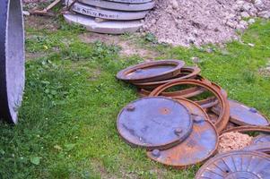 Iron construction manholes metal rusty round at a construction site photo