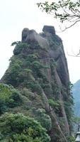 The beautiful mountains landscapes with the green forest and erupted rock cliff as background in the countryside of the China photo