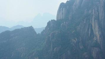 The beautiful mountains landscapes with the green forest and erupted rock cliff as background in the countryside of the China photo