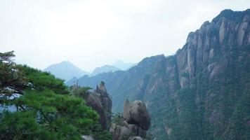 The beautiful mountains landscapes with the green forest and the erupted rock cliff as background in the countryside of the China photo