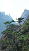 The beautiful mountains landscapes with the green forest and erupted rock cliff as background in the countryside of the China photo