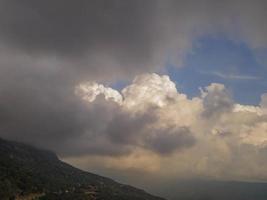 dance of the clouds. cloud and valley view. clouds over green valley photo