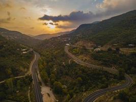 aerial valley and road, Top view, amazing nature background. sunset Flying drone, seascape photo