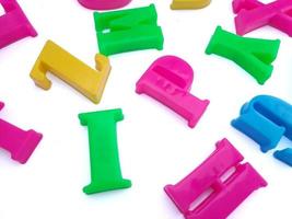 Close up of colorful alphabets on white background perfect for children's education photo