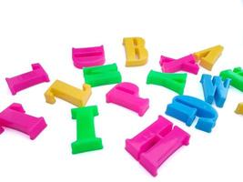 Close up of colorful alphabets on white background perfect for children's education photo