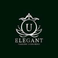 letter U elegant leaves and crown crest vector logo design