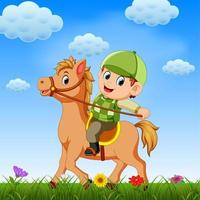 the boy ridding horse and playing with it in the field vector