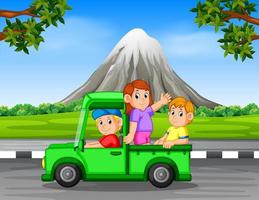 the happy family waving inside the car with the beautiful rock mountain background vector