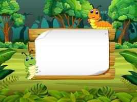 the wooden board blank space with cute caterpillar with forest background