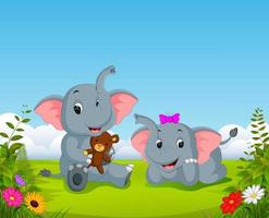 the natural view with the two elephant playing the doll in the yard vector