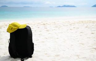 backpack on white beach photo